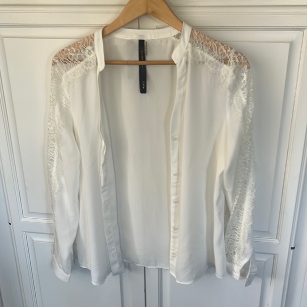 Dress shirt with sheer lace on the top of arms.